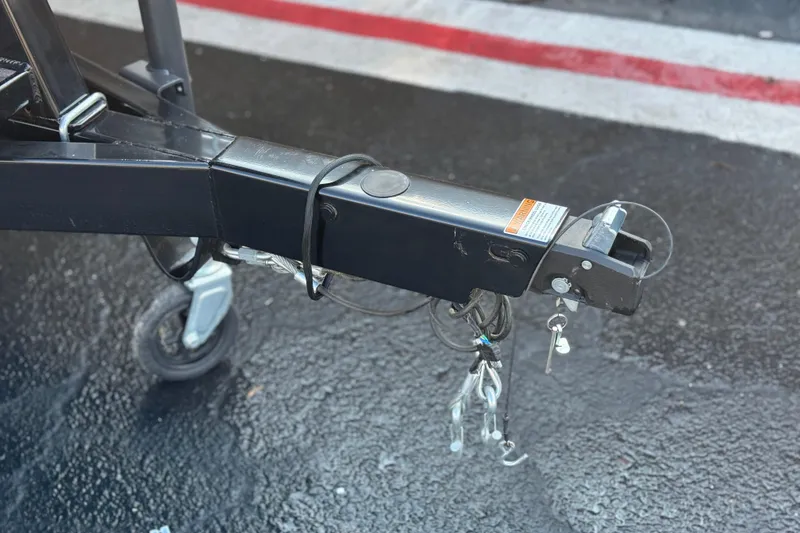 Slide: The Image of Trailer hitch of 2026 Berkshire 22RFX LE on wet pavement. - 27