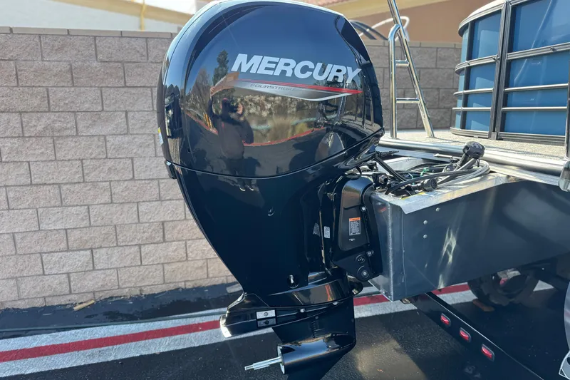 Slide: The Image of Mercury outboard motor on 2026 Berkshire 22RFX LE boat, parked outdoors. - 6