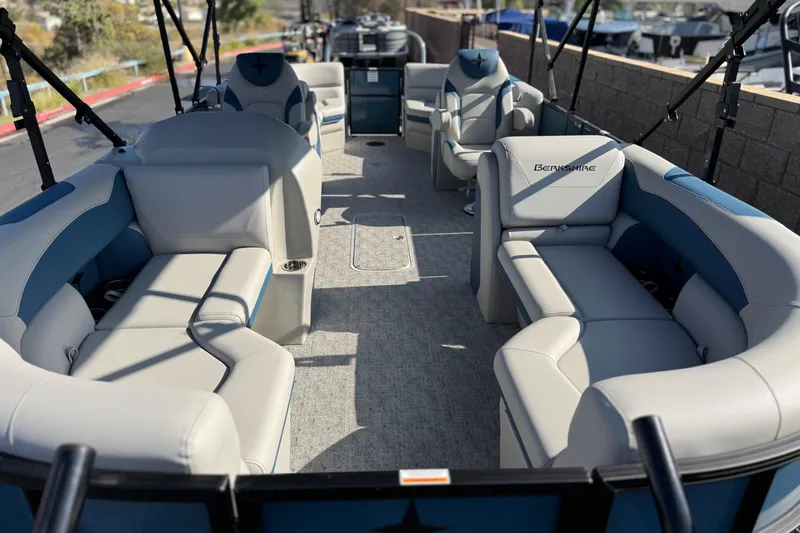 Slide: The Image of 2026 Berkshire 22RFX LE pontoon boat interior with luxurious seating and modern design. - 8