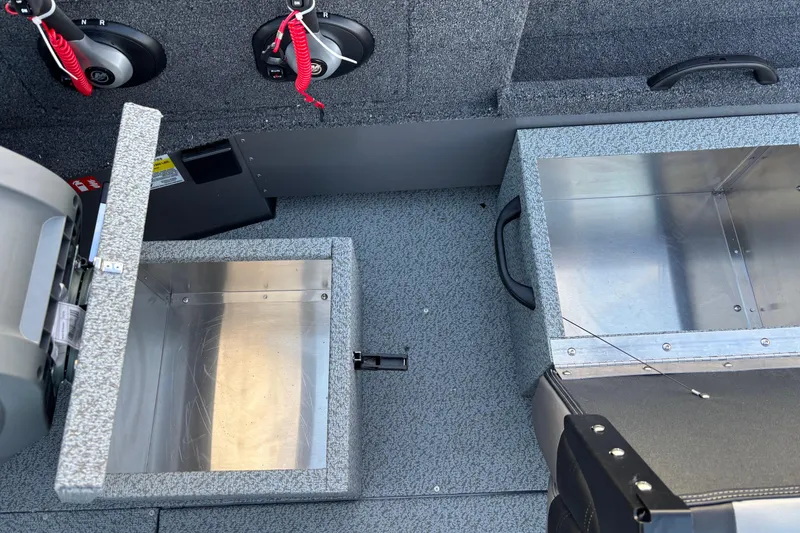 Slide: The Image of Interior of 2026 Crestliner 2050 Commander boat showing storage compartments and safety features. - 4