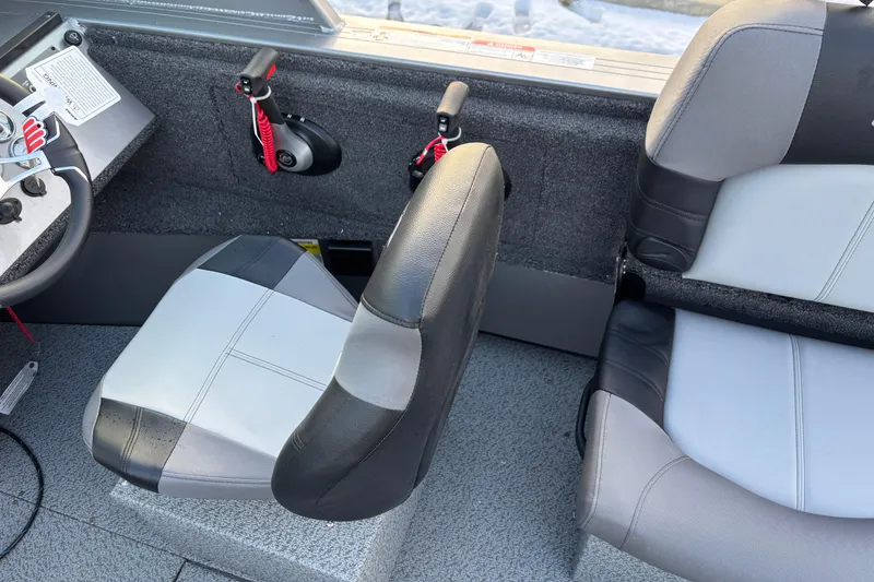 Slide: The Image of Interior of 2026 Crestliner 2050 Commander boat with steering wheel and seats. - 5