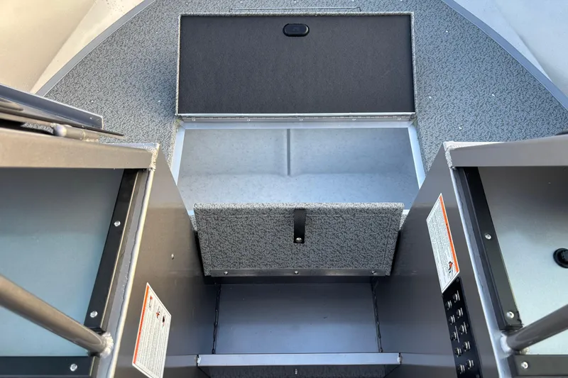 Slide: The Image of 2026 Crestliner 2050 Commander boat interior storage compartment, open and spacious. - 8