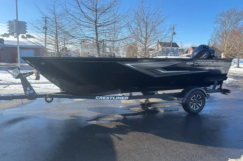Slide: The Image of 2026 Crestliner 1650 Kodiak Tiller boat on trailer, parked on snowy pavement. - 8