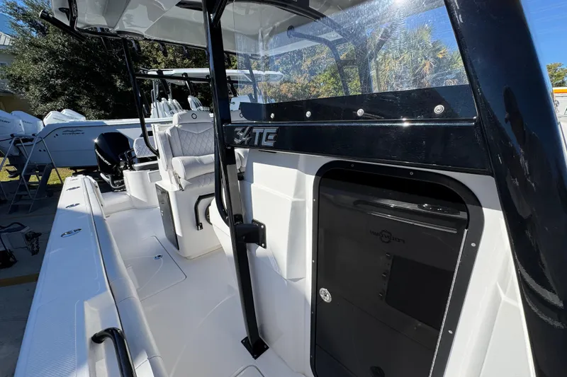 Slide: The Image of 2023 Fountain 34 Tournament Edition boat interior with seating and console details. - 26