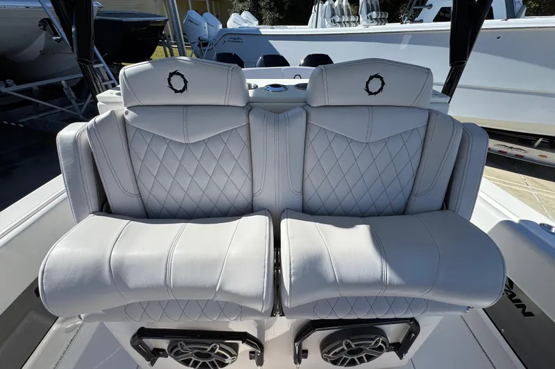 Slide: The Image of Luxury seating on 2023 Fountain 34 Tournament Edition boat, featuring diamond-stitched upholstery. - 30