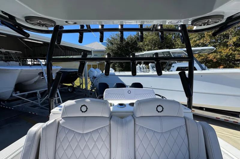 Slide: The Image of 2023 Fountain 34 Tournament Edition boat interior with luxurious seating and rod holders. - 31
