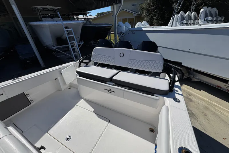 Slide: The Image of 2023 Fountain 34 Tournament Edition boat interior with seating and storage. - 40