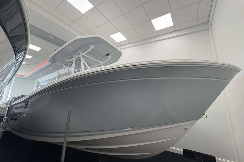 The Image of 2026 Blackfin 222 CC boat displayed indoors, showcasing sleek design and modern features. - 1