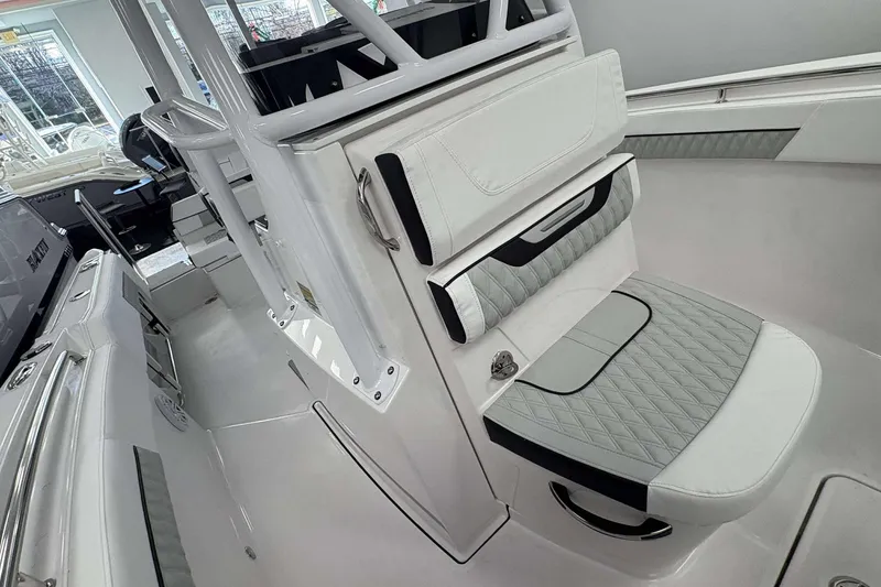 Slide: The Image of 2026 Blackfin 222 CC boat interior with sleek white and gray seating. - 11