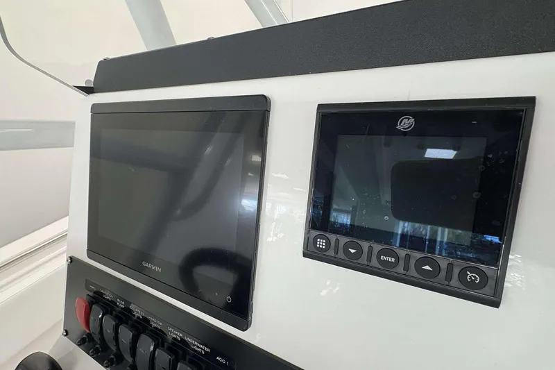 Slide: The Image of Dashboard of 2026 Blackfin 222 CC boat with Garmin and Mercury displays. - 16