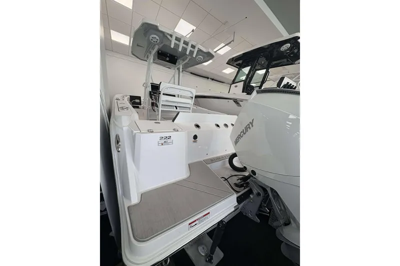 Slide: The Image of 2026 Blackfin 222 CC boat with Mercury engine in showroom. - 19