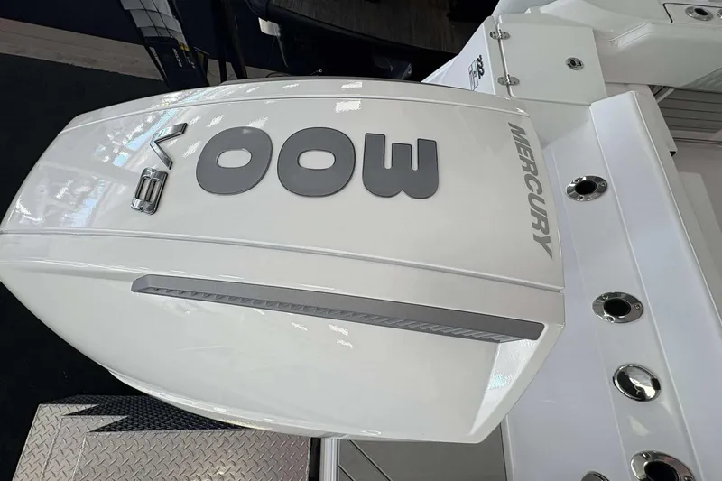 Slide: The Image of 2026 Blackfin 222 CC with Mercury outboard engine, showcasing sleek design. - 25