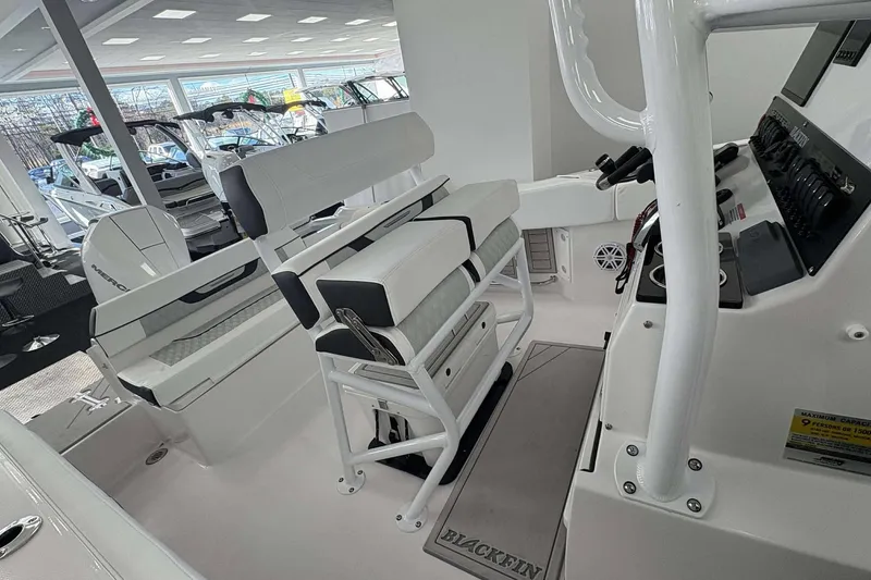 Slide: The Image of 2026 Blackfin 222 CC boat interior with modern seating and control panel. - 4
