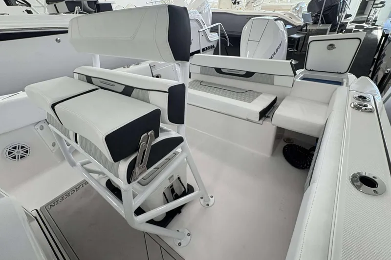 Slide: The Image of 2026 Blackfin 222 CC boat interior with white seating and modern design. - 7