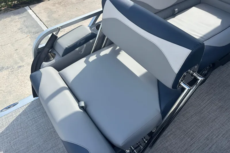 Slide: The Image of 2026 Tahoe Pontoons 23 LTZ Quad Lounge switch with sleek gray and blue seating. - 11
