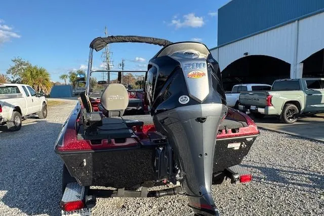 Slide: The Image of 2023 Skeeter Solera 189 boat with powerful outboard motor, parked outdoors. - 10