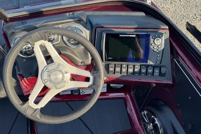 Slide: The Image of 2023 Skeeter Solera 189 dashboard with steering wheel and Humminbird navigation system. - 16