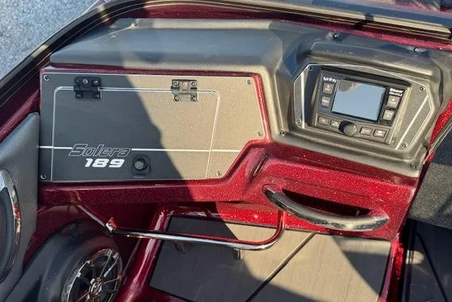 Slide: The Image of 2023 Skeeter Solera 189 dashboard with control panel and storage compartment. - 17