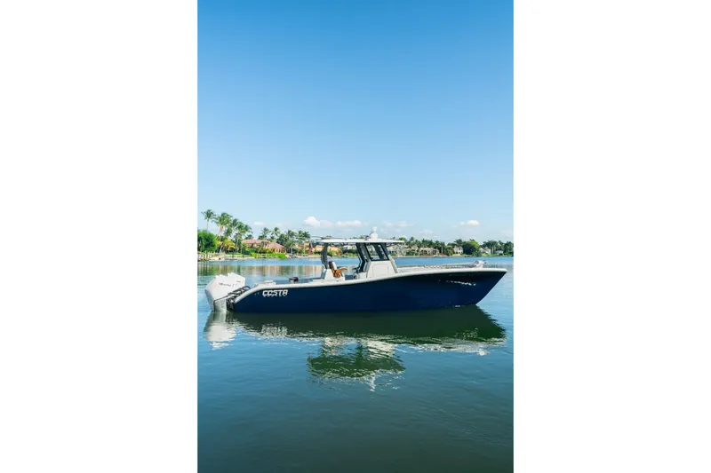 The Image of 2025 Costa Custom Boats 34 on calm water, clear sky, and scenic background. - 0