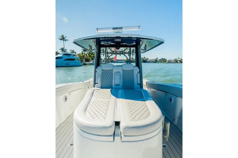 Slide: The Image of 2025 Costa Custom Boats 34 model with luxurious seating on a sunny day. - 10