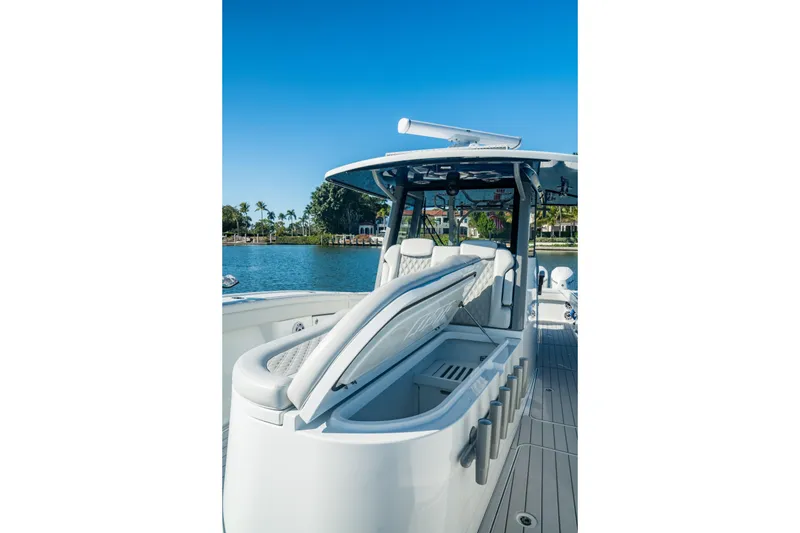 Slide: The Image of 2025 Costa Custom Boats 34 model on water, showcasing sleek design and luxury seating. - 14