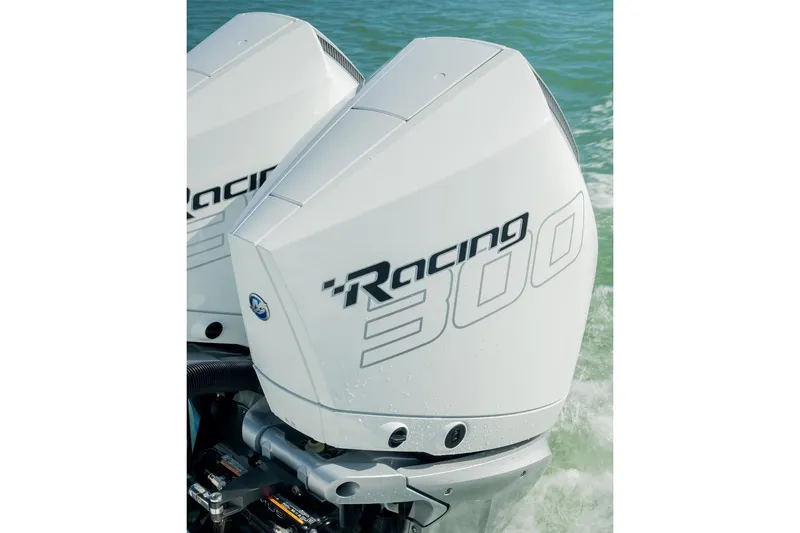 Slide: The Image of 2025 Costa Custom Boats 34 with powerful Racing 300 outboard engines on water. - 17