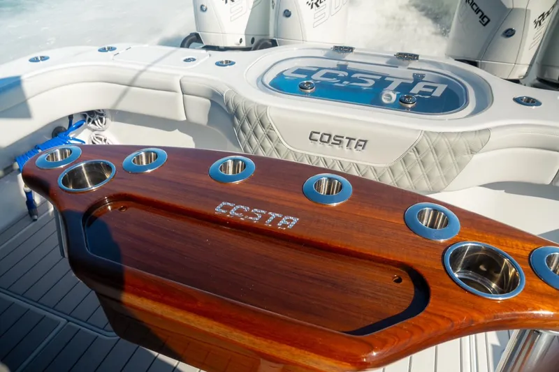 Slide: The Image of 2025 Costa Custom Boats 34, featuring elegant woodwork and modern design elements. - 6