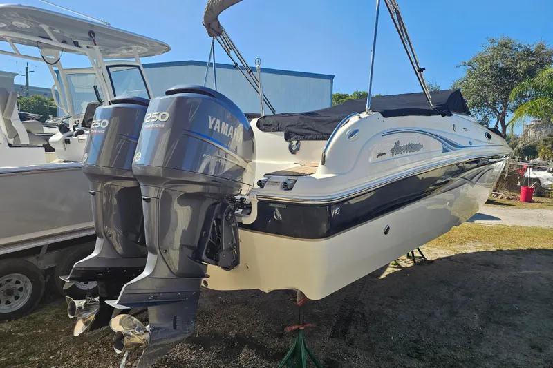 Slide: The Image of 2006 Hurricane SunDeck 260 OB boat with twin Yamaha 250 engines, parked outdoors. - 7