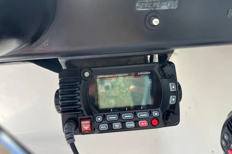 Slide: The Image of Standard Horizon Explorer radio on 1992 Bayliner Trophy 2000 dashboard. - 12