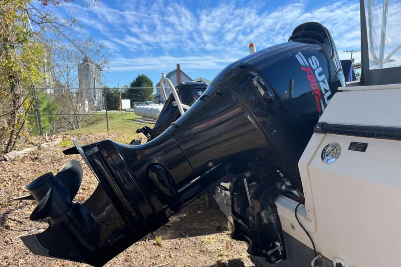 Slide: The Image of 1992 Bayliner Trophy boat with Suzuki outboard motor under clear blue sky. - 19