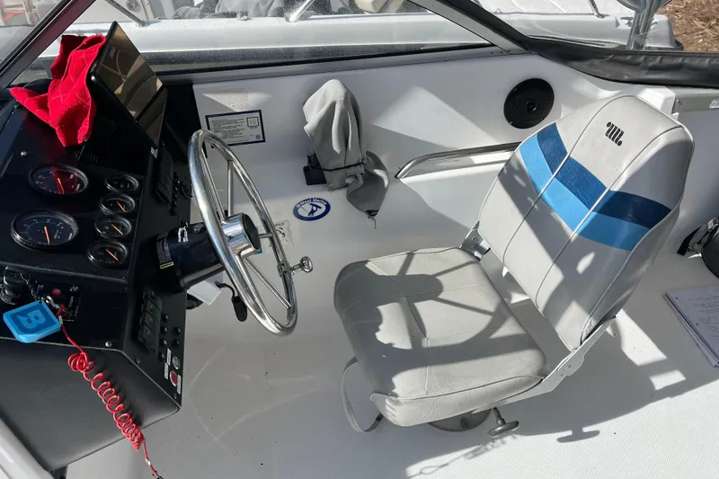 Slide: The Image of Interior of 1992 Bayliner Trophy 2000 boat showing steering wheel and captain's chair. - 4