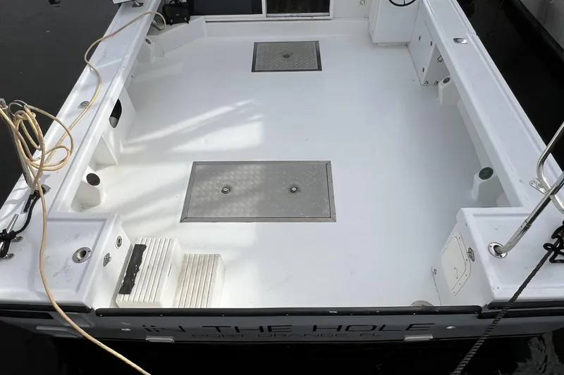 Slide: The Image of 2006 Provincial 42 Lobster Boat deck, featuring spacious layout and storage compartments. - 11