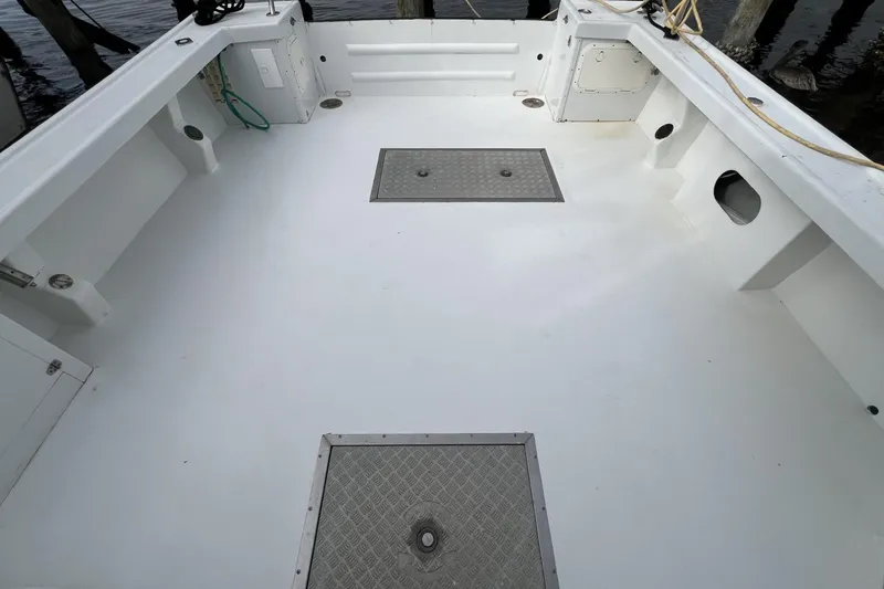 Slide: The Image of Spacious deck of 2006 Provincial 42 Lobster Boat, featuring clean white surface and storage hatches. - 12