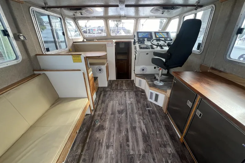 Slide: The Image of Interior of 2006 Provincial 42 Lobster Boat with seating and navigation equipment. - 13