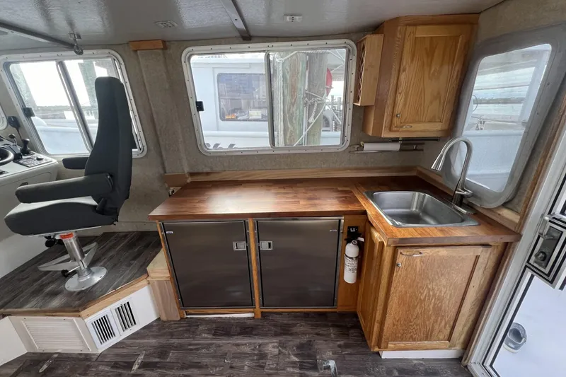 Slide: The Image of Interior of 2006 Provincial 42 Lobster Boat with wooden cabinetry and modern amenities. - 14