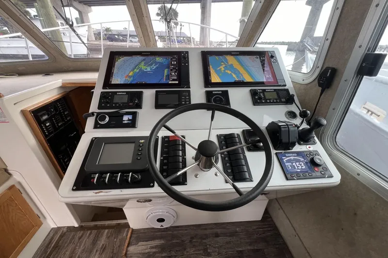Slide: The Image of Cockpit of 2006 Provincial 42 Lobster Boat with navigation screens and controls. - 16
