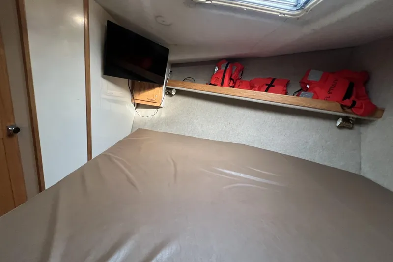 Slide: The Image of Cozy cabin interior of 2006 Provincial 42 Lobster Boat with TV and life jackets. - 27