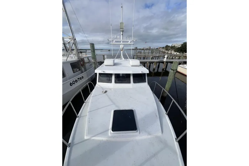 Slide: The Image of 2006 Provincial 42 Lobster Boat docked at marina under cloudy sky. - 4