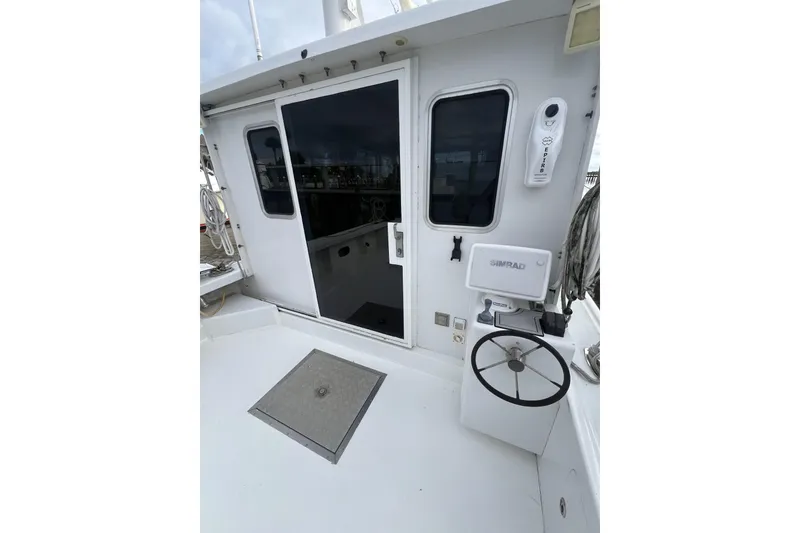 Slide: The Image of 2006 Provincial 42 Lobster Boat deck with steering wheel and navigation equipment. - 9