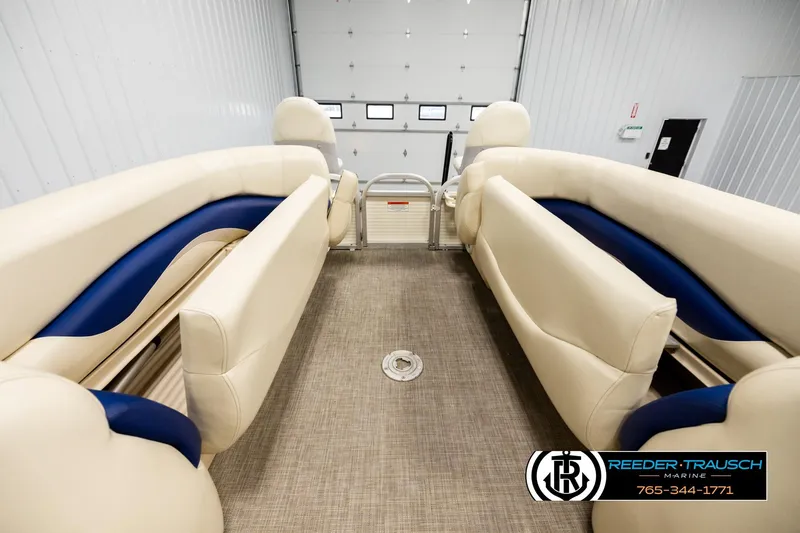 Slide: The Image of 2008 Sun Tracker Party Barge 24 interior with beige and blue seating. - 18