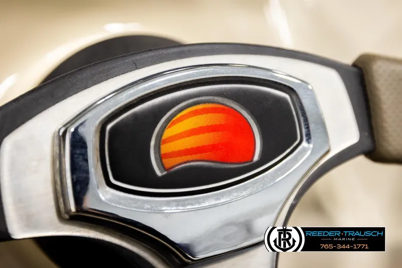 Slide: The Image of Close-up of Sun Tracker Party Barge 24 steering wheel emblem, 2008 model. - 21