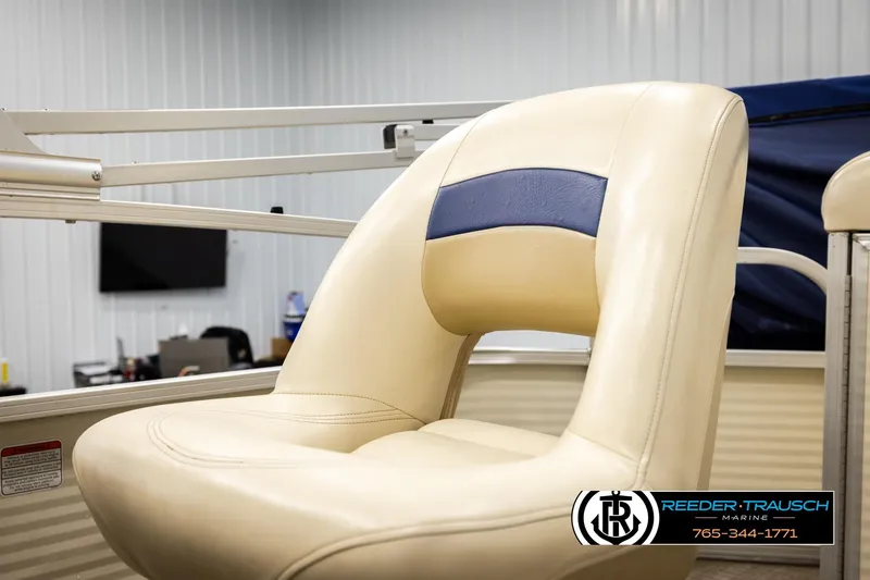 Slide: The Image of 2008 Sun Tracker Party Barge 24 boat seat in a showroom setting. - 27