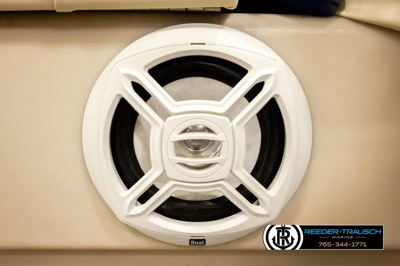 Slide: The Image of White speaker on 2008 Sun Tracker Party Barge 24, beige interior, Reeder-Trausch Marine logo. - 30