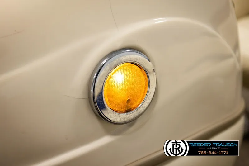 Slide: The Image of Close-up of a 2008 Sun Tracker Party Barge 24 amber side light. - 32