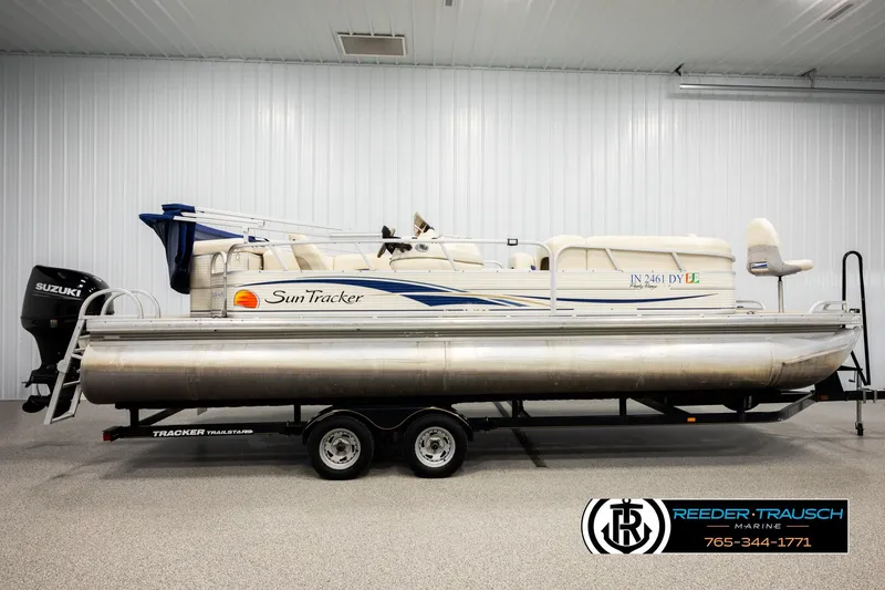 Slide: The Image of 2008 Sun Tracker Party Barge 24 pontoon boat on trailer in indoor showroom. - 4
