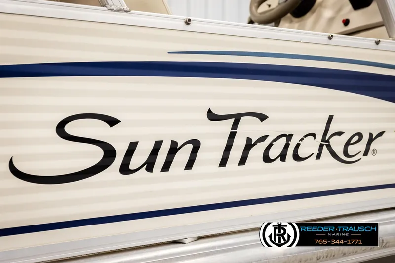 Slide: The Image of 2008 Sun Tracker Party Barge 24 boat side view with logo and dealership details. - 41