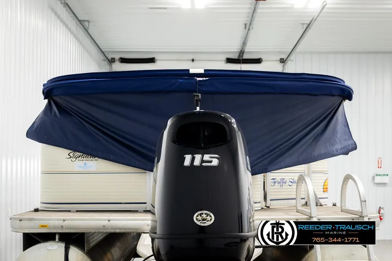 Slide: The Image of 2008 Sun Tracker Party Barge 24 with 115 HP engine in storage facility. - 6