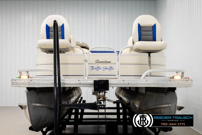 Slide: The Image of 2008 Sun Tracker Party Barge 24 pontoon boat in indoor storage. - 7