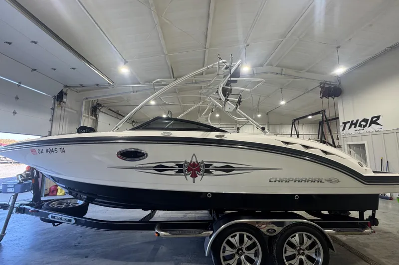 The Image of 2008 Chaparral Sunesta 244 Xtreme boat in a garage, side view. - 0