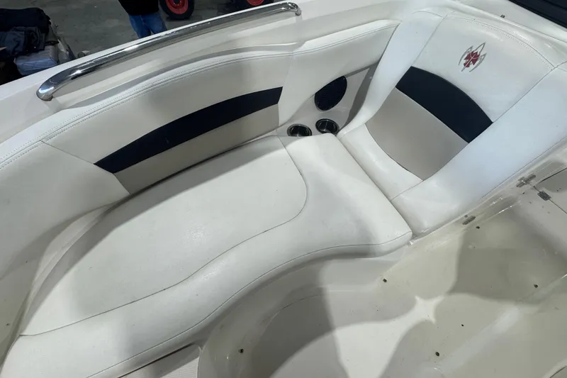 Slide: The Image of 2008 Chaparral Sunesta 244 Xtreme boat interior with white and black seating. - 13